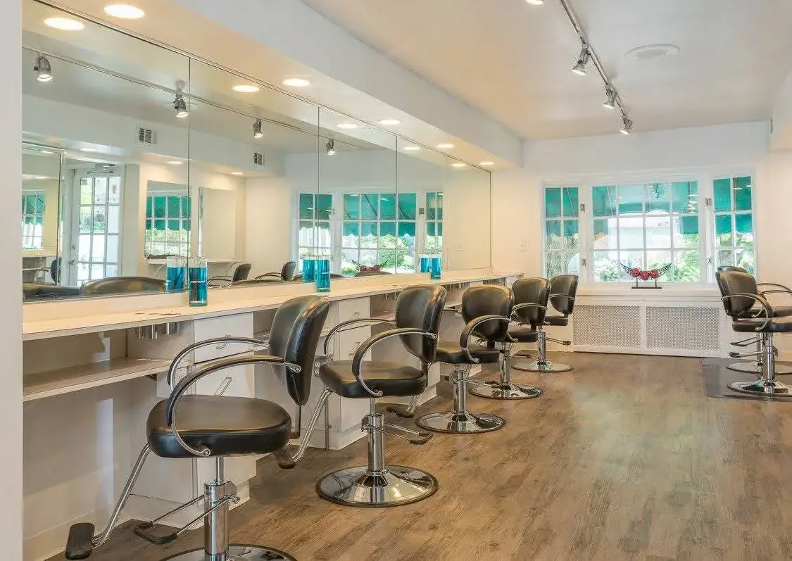 Salon chairs and mirrors at De Amour Salon